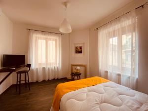 Postel nebo postele na pokoji v ubytování Carrales Guest House