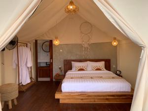 Postelja oz. postelje v sobi nastanitve Pinggan luxury camp