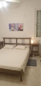 a bedroom with a bed and a window at Sea Heart Villa Beachfront in Pyla