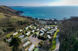 an aerial view of a village next to the ocean at Revelstoke Park House in Noss Mayo