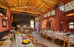 a large room with tables and chairs in it at La Pimpinella di Semifonte in San Donnino