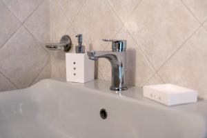 a sink with a faucet on top of it at Casa Max in Levanto