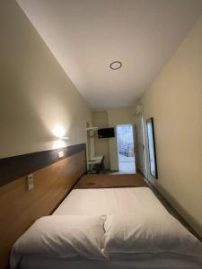 a bedroom with a large bed in a room at Hostal Oliver in Madrid