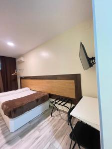 Postel nebo postele na pokoji v ubytování Hostal Oliver