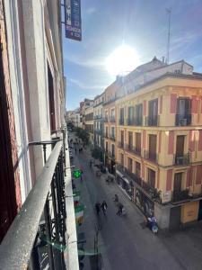 a view from a balcony of a street with buildings at Hostal Oliver in Madrid