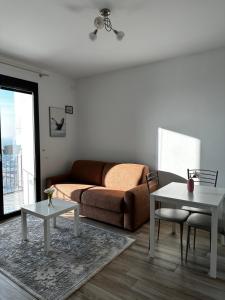 a living room with a couch and a table at Sweet Home in Milano smart district in Milan