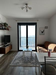 a living room with a couch and a table at Sweet Home in Milano smart district in Milan
