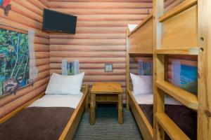 a room with two bunk beds and a table at Great Wolf Lodge Traverse City in Traverse City