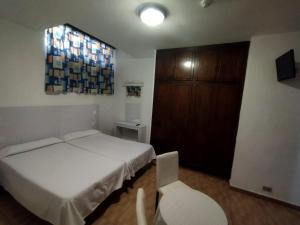 Cama o camas de una habitación en Hotel Casa del Sol