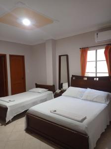 Postel nebo postele na pokoji v ubytování Hotel Damys