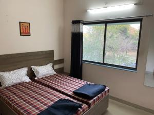 Postel nebo postele na pokoji v ubytování Samruddhi S1 homestay garden villa or S3