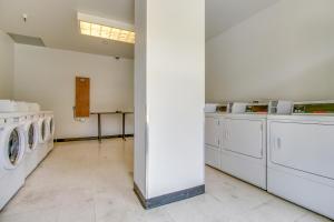 a laundry room with white washing machines and a wall at Village Square in Copper Mountain