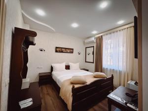 Postel nebo postele na pokoji v ubytování Aspar Boutique Hotel