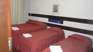 Katil atau katil-katil dalam bilik di Hotel Apollo