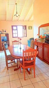 a dining room table and chairs in a kitchen at Maison de 3 chambres avec jardin clos et wifi a Anse Bertrand in Anse-Bertrand