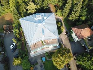 an overhead view of a house with a glass roof at Hotel Schlossberg in Badenweiler