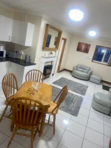 a kitchen and living room with a table and chairs at Beautiful 3-Bed Bungalow in Bawtry Doncaster in Doncaster