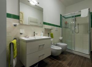 a bathroom with a sink and a toilet and a shower at Il Cardo in Spinetoli
