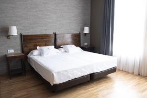 Posteľ alebo postele v izbe v ubytovaní Balneario de Mondariz