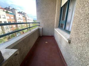 a balcony of a building with a window at Apartamento centro Vitoria in Vitoria-Gasteiz