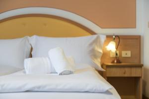 Postel nebo postele na pokoji v ubytování Hotel Antico Monastero