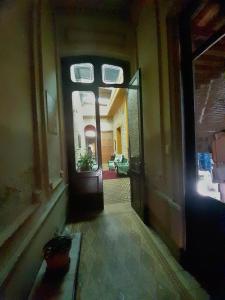 an empty hallway with a door in a house at El Patio de la Morocha in Montevideo