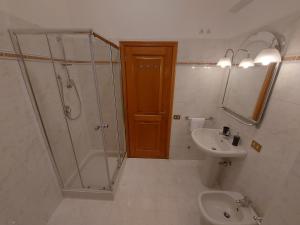 a bathroom with a shower and a sink and a toilet at VATICAN PITTORE HOUSE in Rome