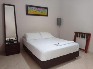 Postel nebo postele na pokoji v ubytování Hotel Damys