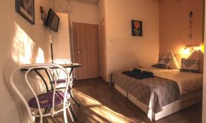 Postel nebo postele na pokoji v ubytování Pensili Apartmanház Balatonfüred