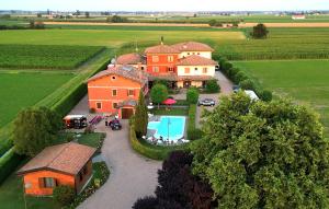 an aerial view of a house in a field at Hotel Tre Torri in Medolla