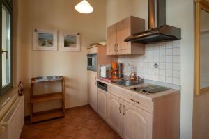 a kitchen with a sink and a counter top at Villa Stock Appartement mit großer Veranda in Heringsdorf