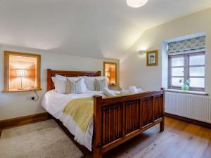 a bedroom with a large bed and a window at 1 bed in Somerton 41733 in Babcary