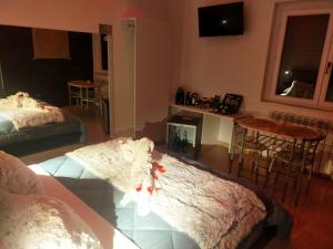 Postel nebo postele na pokoji v ubytování B&B GRECALE Suite & Spa