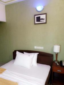 Ліжко або ліжка в номері EKA ELITE HOTEL