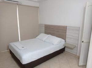 Postel nebo postele na pokoji v ubytování Hotel Damys