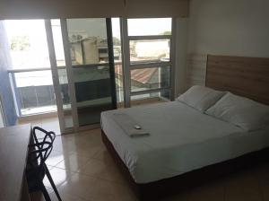 Postel nebo postele na pokoji v ubytování Hotel Damys