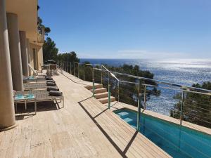 a balcony of a building with a view of the ocean at Finca S' Estoneta con increíbles vistas al mar in Capdepera