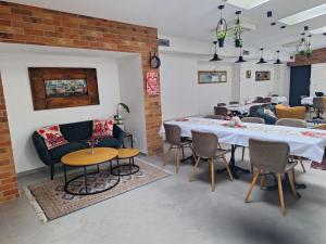 a living room with a table and chairs at Stara Plebania in Ponice