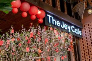 a store with a display of flowers and red lanterns at Seahorse Tropical Da Nang Hotel by Haviland in Da Nang