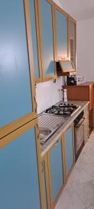 a kitchen with a stove and a stove top oven at Residenza Infante in Avezzano