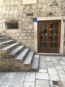 a set of stairs in front of a building with a door at Rooms Base in Split