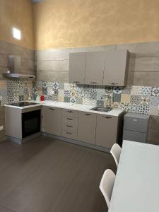 Kuchyň nebo kuchyňský kout v ubytování Casa Mattia - City