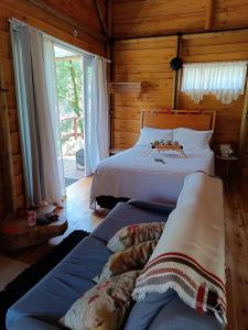 Postel nebo postele na pokoji v ubytování Cabana hidromassagem Morada Alma Gêmea