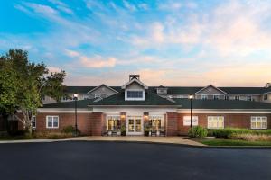 a large brick house with a driveway at Homewood Suites by Hilton Manchester/Airport in Manchester