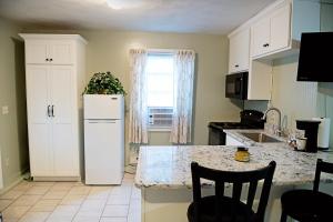 a kitchen with a white refrigerator and a counter at Berry Patch BnB in Lebanon