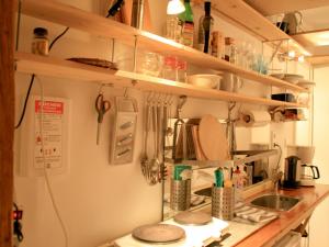 a kitchen with a sink and a counter with utensils at Ferienwohnung Altes Haus 1 in Lindau +12 photos