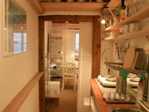 a kitchen with a counter and a dining room at Ferienwohnung Altes Haus 1 in Lindau