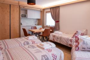 Postel nebo postele na pokoji v ubytování Chalet al Tabià