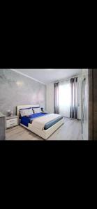 En eller flere senge i et værelse på Intero Appartamento ospedale Niguarda + 3 billeder