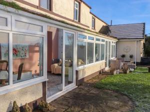 a extension to a house with sliding glass doors at The Stables in Wigton
